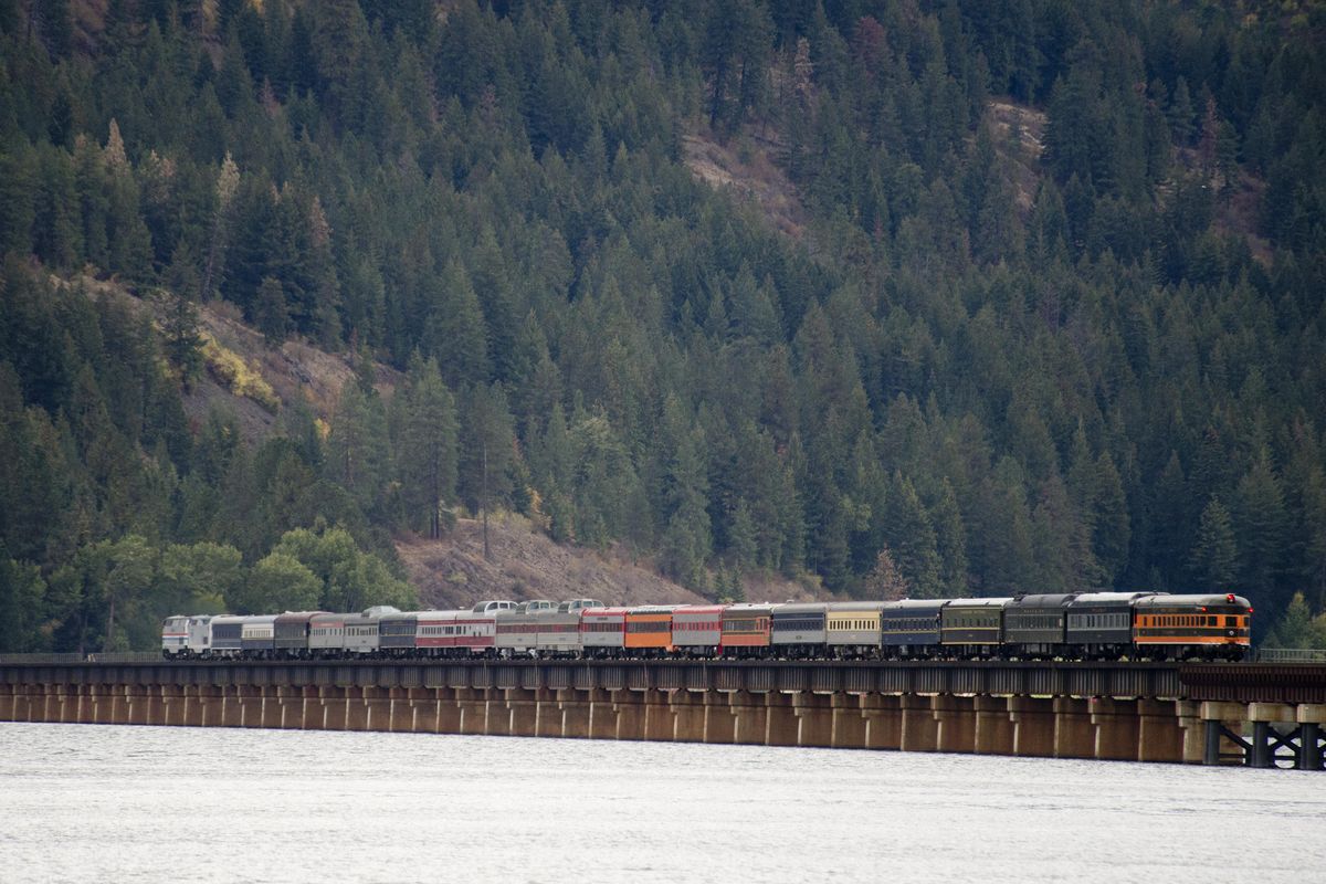 A collection of restored private railcars travels over Lake Pend Oreille Monday, Sept. 19, 2016 after a stop in Sandpoint. The train was assembled in Denver, Colorado and was enroute to Spokane. The final car, at right, is called City of Spokane and features a rounded tail with observation windows. (Jesse Tinsley / The Spokesman-Review)