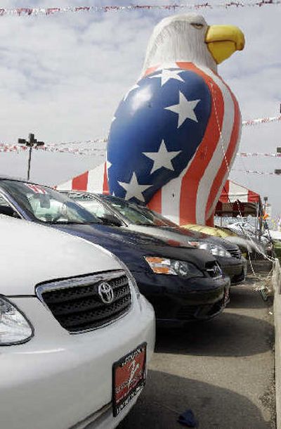 
Toyota vehicles are on display with an American eagle in background at a Toyota dealership in Stockton, Calif., Tuesday. Toyota Motor Corp. trounced the domestic automakers in the U.S. marketplace last month. 
 (Associated Press / The Spokesman-Review)
