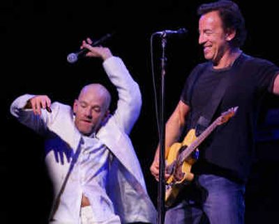 
Michael Stipe, left, of R.E.M., and Bruce Springsteen perform at the 