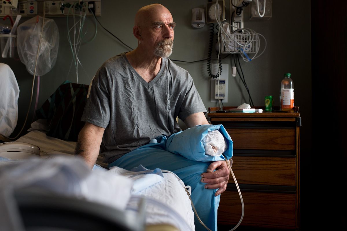 Daniel “Dutch” Inwood poses for a photo in his hospital room on Thursday, April 27, 2017, at Sacred Heart in Spokane, Wash. Inwood lost his leg in a hit-and-run motorcycle accident. (Tyler Tjomsland / The Spokesman-Review)