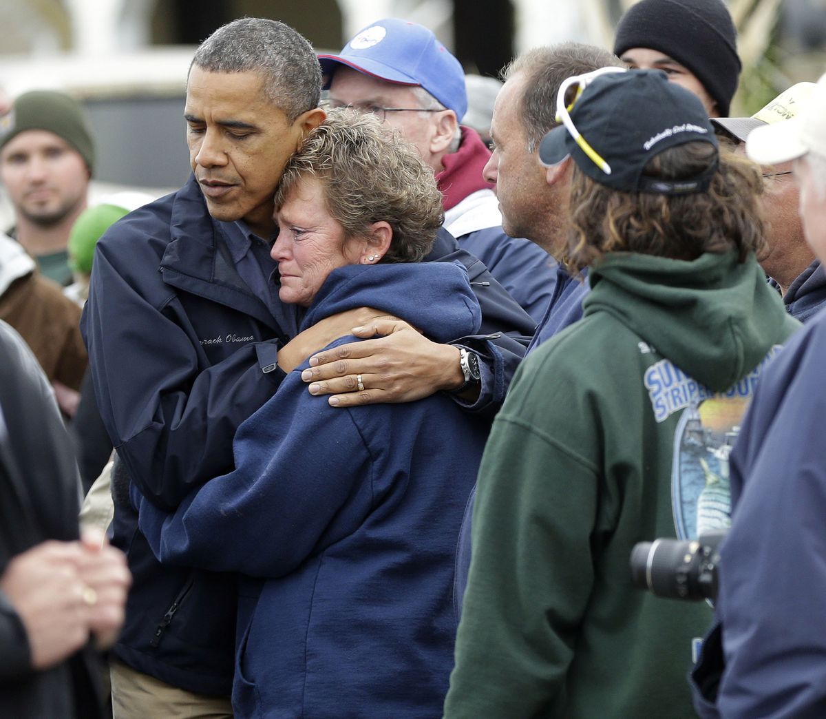 President Barack Obama embraces Donna Vanzant on Wednesday during a tour of a Brigantine, N.J., neighborhood. Vanzant is an owner of North Point Marina, which was damaged by the superstorm. (Associated Press)