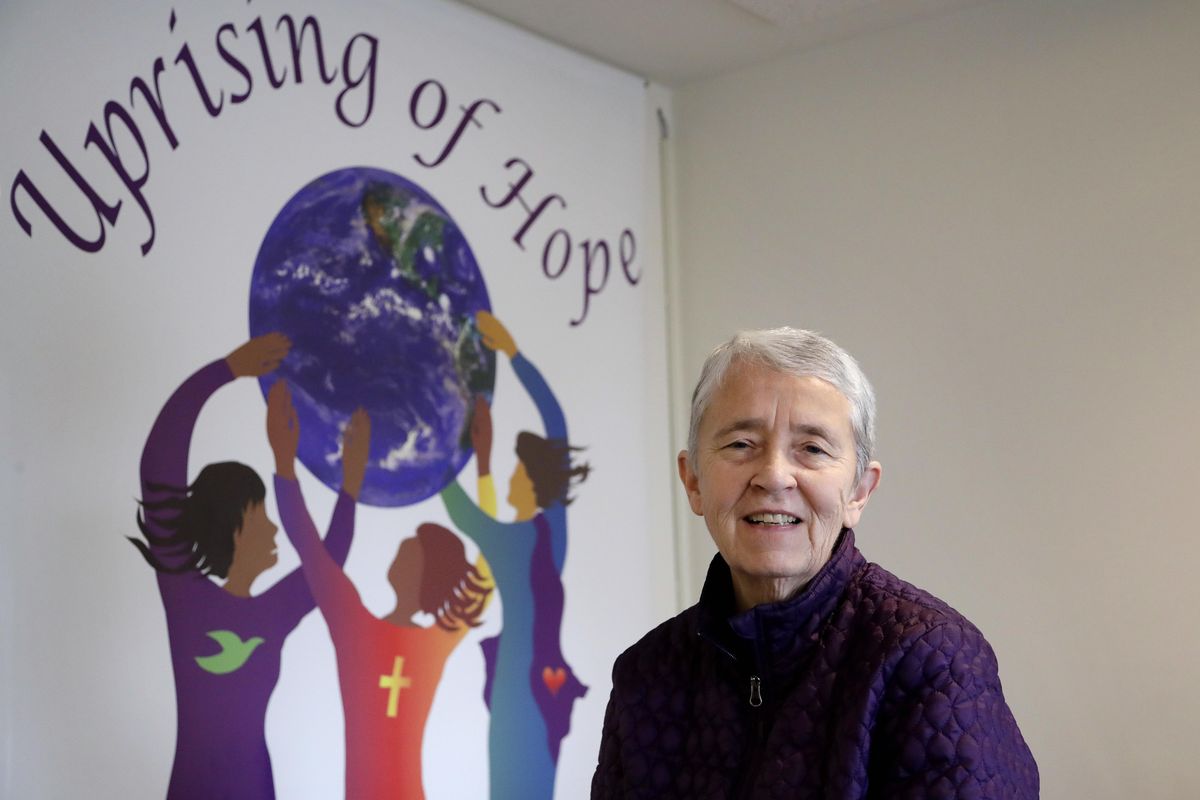 Sister Judy Byron, director and coordinator of the Northwest Coalition for Responsible Investment, poses for a photo in her office in Seattle.Byron says her group and BlackRock appear to have similar ideas when it comes to gun manufacturers and retailers. (Associated Press)