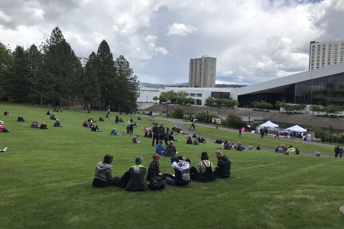 Protesters begin gathering in the Lilac Bowl in Riverfront Park shortly before 2 p.m. on Sunday, June 14, 2020. It