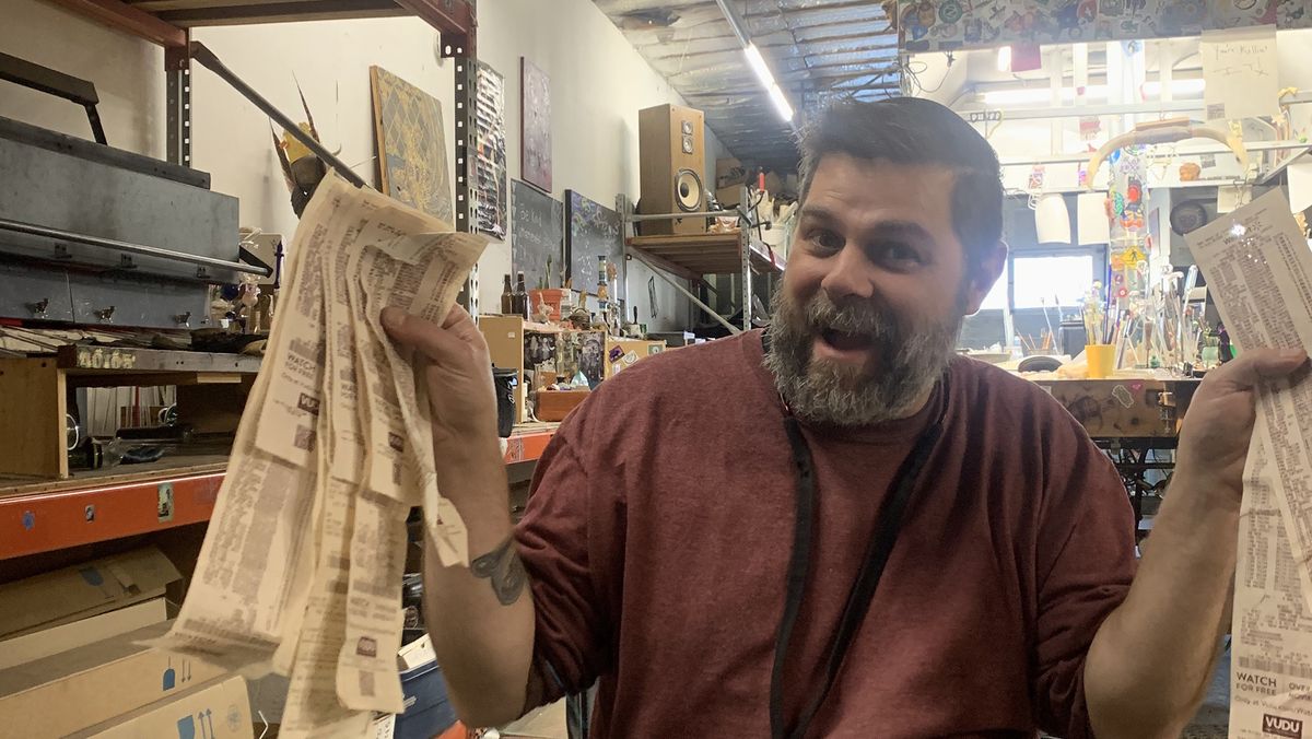 Brandon Welk displays a receipt from a past year’s Christmas drive shopping. (Linda Ball/Evercannabis)