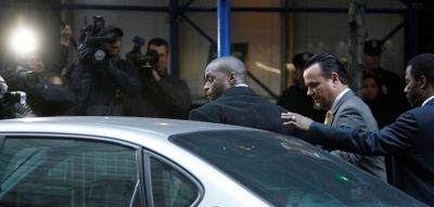 Giants wide receiver Plaxico Burress leaves a New York City police station.  (Associated Press / The Spokesman-Review)