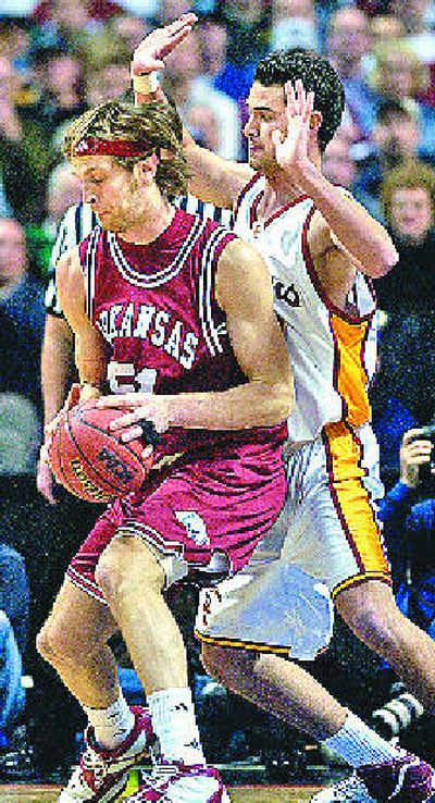 
USC's Keith Wilkinson, right, tightens up the defense against Steven Hill of Arkansas.  
 (Holly Pickett / The Spokesman-Review)