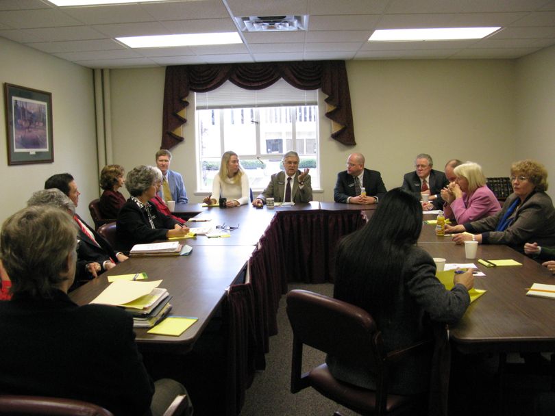 House Democrats meet in an open caucus to discuss state employee pay cuts and the state budget, while House Republicans met behind closed doors to talk about that and transportation on Thursday morning. (Betsy Russell / The Spokesman-Review)