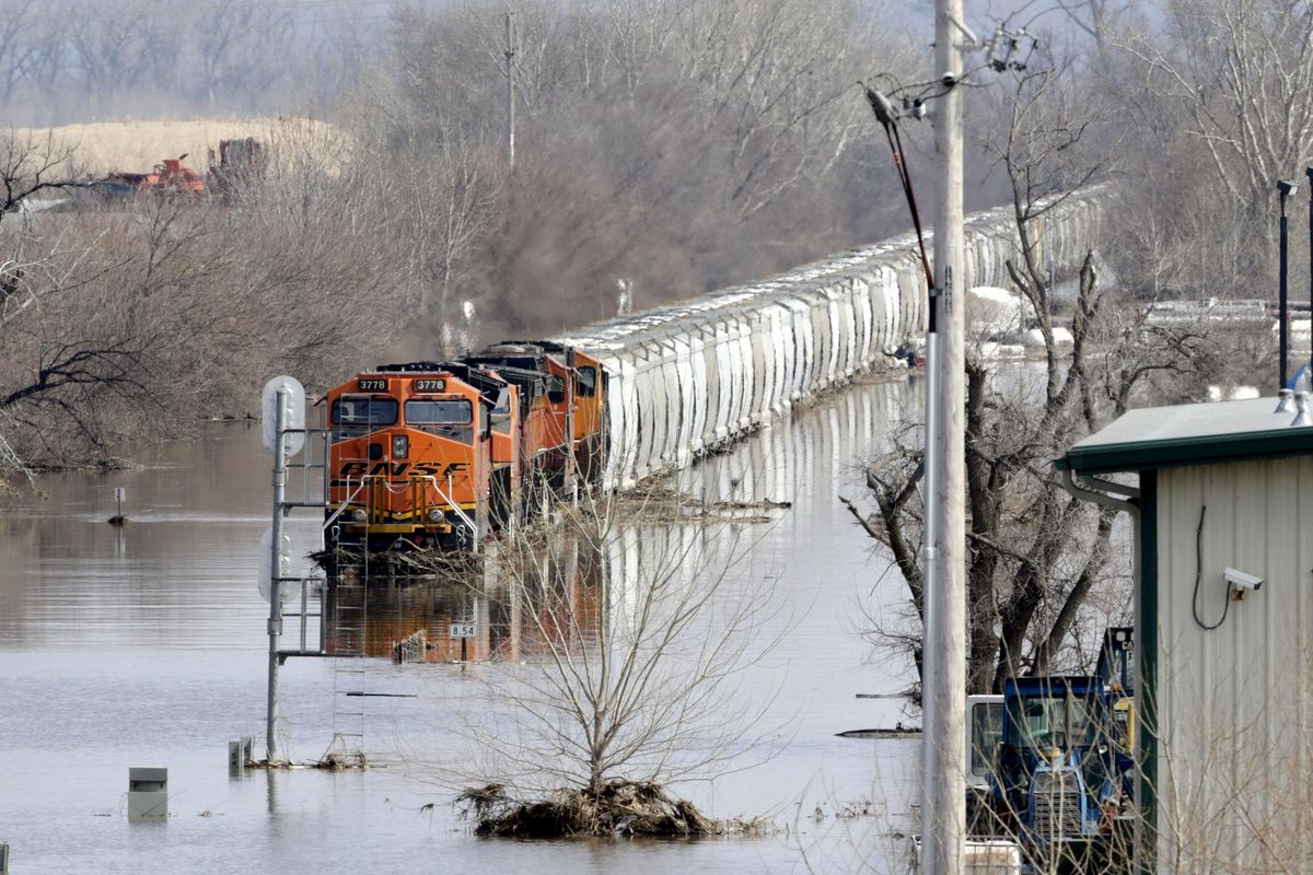 A BNSF train sits in flood waters from the Platte River, in Plattsmouth, Neb., Sunday, March 17, 2019. Hundreds of people remained out of their homes in Nebraska, but rivers there were starting to recede. The National Weather Service said the Elkhorn River remained at major flood stage but was dropping. (Nati Harnik / AP)