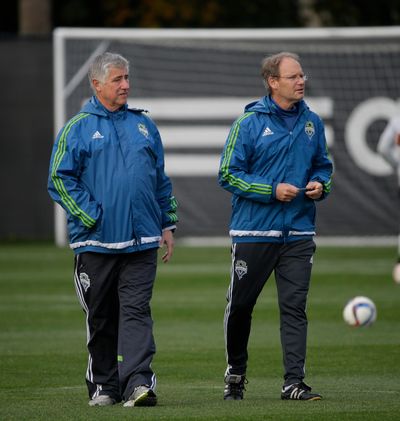 Former Sounders head coach Sigi Schmid, left, had good success against the Timbers but now it is up to his former assistant and current interim head coach Brian Schmetzer, right, to continue that good fortune. (Ted S. Warren / Associated Press)