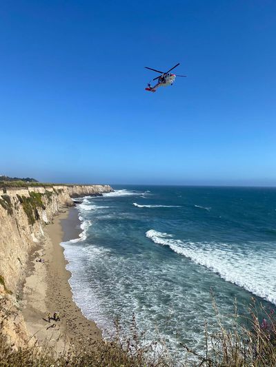 A stranded windsurfer was rescued off a beach south of Davenport Landing in California after he used rocks Sunday to spell out “HELP” in the sand.  (California Department of Forestry and Fire Protection/TNS)
