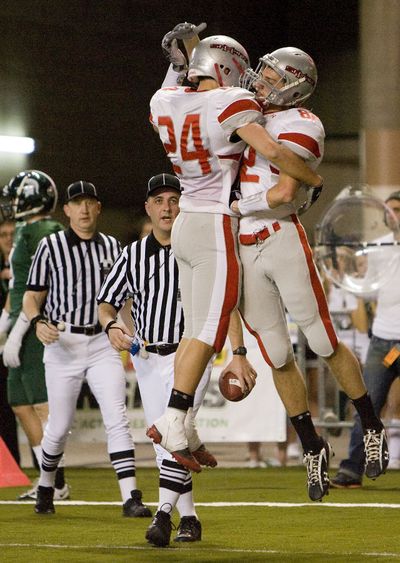 Ferris wide receivers Jordan Tonani, left, and Jason Bates celebrate Bates' 2nd touchdown catch of the game Saturday, Dec. 5, 2009, during  the state 4A championship game. (Patrick Hagerty / Special to The Spokesman-Review)