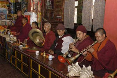 
Buddhist monks play musical instruments during a public memorial service Monday for Sir Edmund Hillary at a monastery in Katmandu, Nepal.  Associated Press
 (Associated Press / The Spokesman-Review)