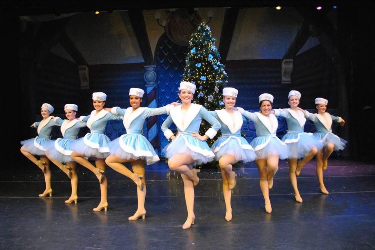 Performers prep for a kickline in a previous year’s “Traditions of Christmas.” (Courtesy photo)