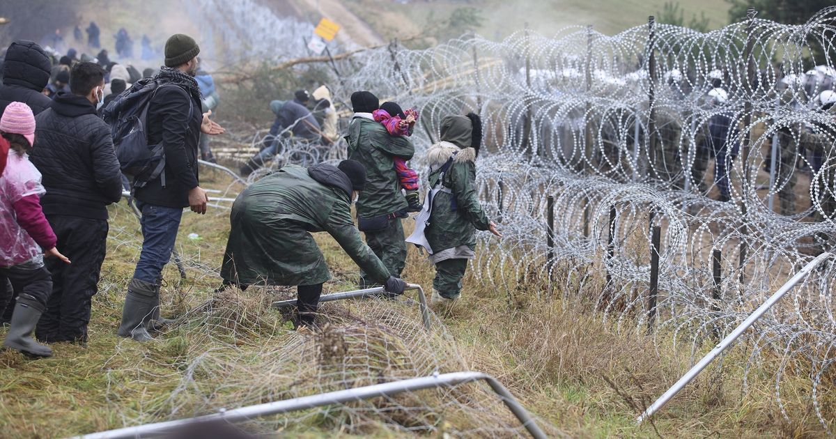 migrants aided by belarus try to storm across poland border the spokesman review