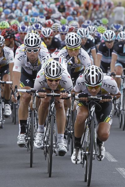 The HTC Highroad team of Mark Cavendish leads the chase of the pack on the breakaway group during Sunday’s 15 stage. (Associated Press)