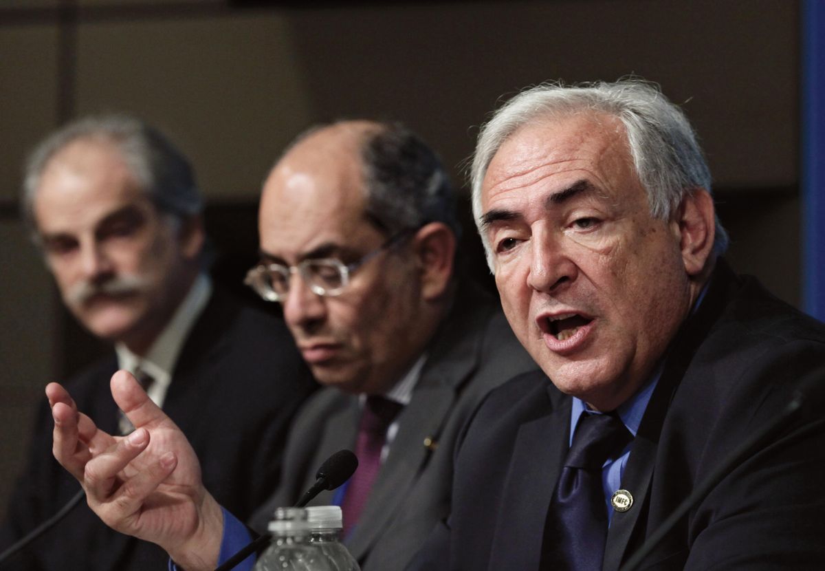 IMF Managing Director Dominique Strauss-Kahn,  Egyptian Finance Minister Youssef Boutros-Ghali  and IMF First Deputy Managing Director John Lipsky, from right, talk to reporters Saturday.  Photos by  (Photos by Associated Press / The Spokesman-Review)