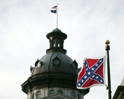 A Confederate battle flag flies in front of the South Carolina statehouse Wednesday, July 8, 2015, in Columbia, S.C. The House is expected to debate a measure Wednesday that would remove the flag from the Capitol grounds. (John Bazemore / Associated Press)