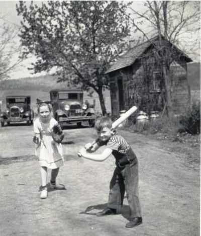 Barb Ulowetz and Dick Redinger play ball at the Ulowetz Farm in Trent circa 1925.