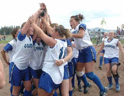 The Coeur d'Alene Vikings celebrate their 1-0 win over Lake City Wednesday in the 5A Region I softball tournament championship game, qualifying them for the state tournament.
(Jesse Tinsley / The Spokesman-Review)