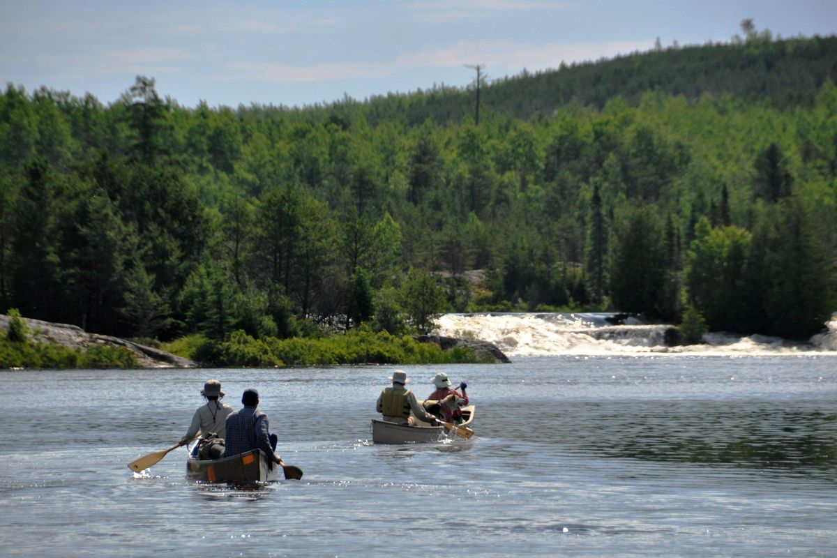 Paddlers head upstream to portage above a waterfall in Quetico. (Rich Landers / The Spokesman-Review)