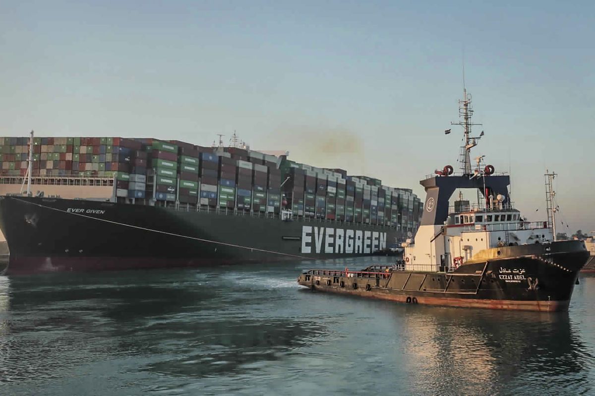 In this photo released by Suez Canal Authority, the Ever Given, a Panama-flagged cargo ship, is pulled by one of the Suez Canal tugboats, in the Suez Canal, Egypt, Monday, March 29, 2021. Engineers on Monday "partially refloated " the colossal container ship that continues to block traffic through the Suez Canal, authorities said, without providing further details about when the vessel would be set free. (Associated Press)