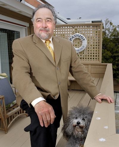 FILE - In this Dec. 3, 2007 file photo, radio talk show host Michael Savage poses with his dog Teddy in Tiburon, Calif. Savage won a legal battle Thursday Sept. 27, 2012 and announced he was leaving Talk Radio Network, which broadcast his show that attracted more than 8 million listeners a week. (John Storey / Associated Press)