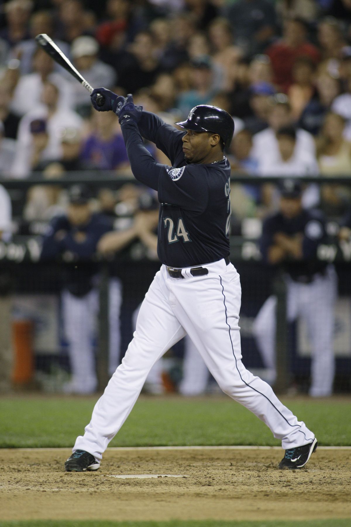 Ken Griffey Jr. hits a double in the eighth, the 515th of his career. He moved past former M’s teammate Edgar Martinez into a tie for 38th place on the all-time list.  (Associated Press / The Spokesman-Review)