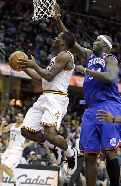 Cleveland’s Jeremy Pargo, who scored a career-high 28 points, drives past Philadelphia’s Kwame Brown for a shot. (Associated Press)