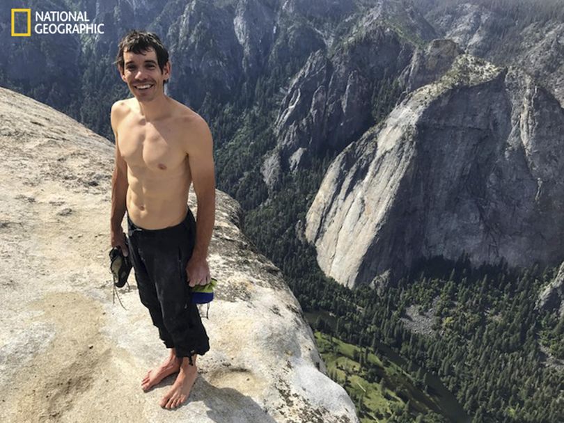 This  June 3, 2017, photo shows Alex Honnold atop El Capitan in Yosemite National Park, Calif., after he became the first person to climb alone to the top of the massive granite wall without ropes or safety gear.  Honnold and his climbing partner Tommy Caldwell on Wednesday, May 30, 2018, raced up the nearly 90-degree, 2,900-foot  precipice in 2 hours 10 minutes 15 seconds to break a speed record. (Jimmy Chin / National Geographic)