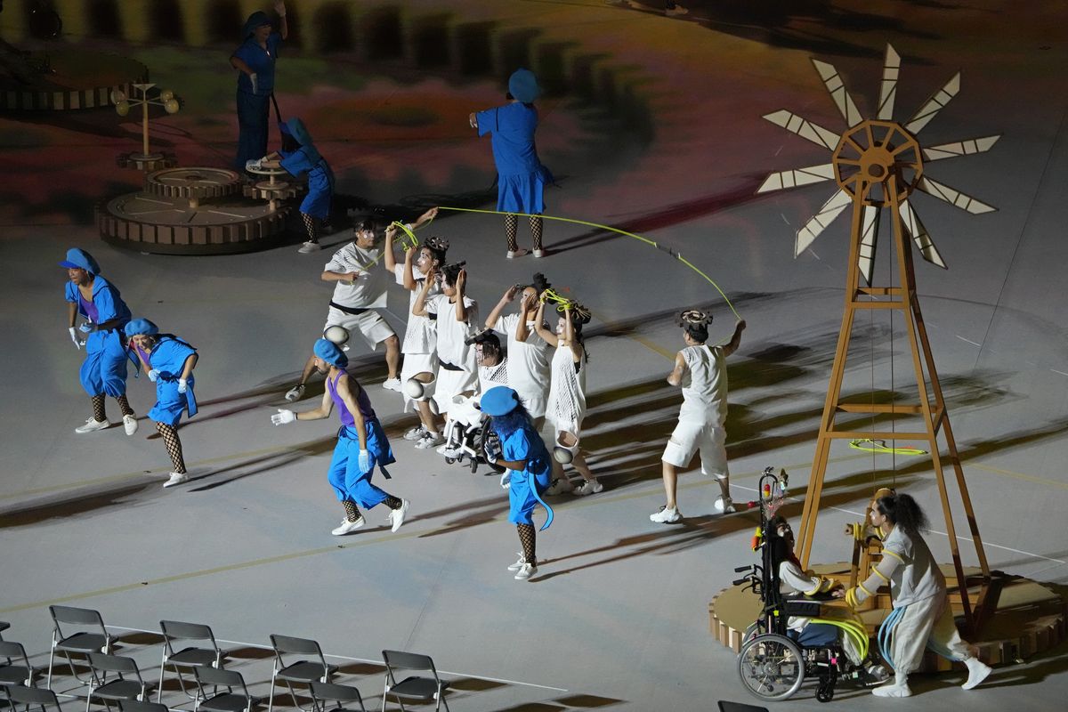 Actors perform during the opening ceremony for the 2020 Paralympics at the National Stadium in Tokyo, Tuesday, Aug. 24, 2021.  (Eugene Hoshiko)