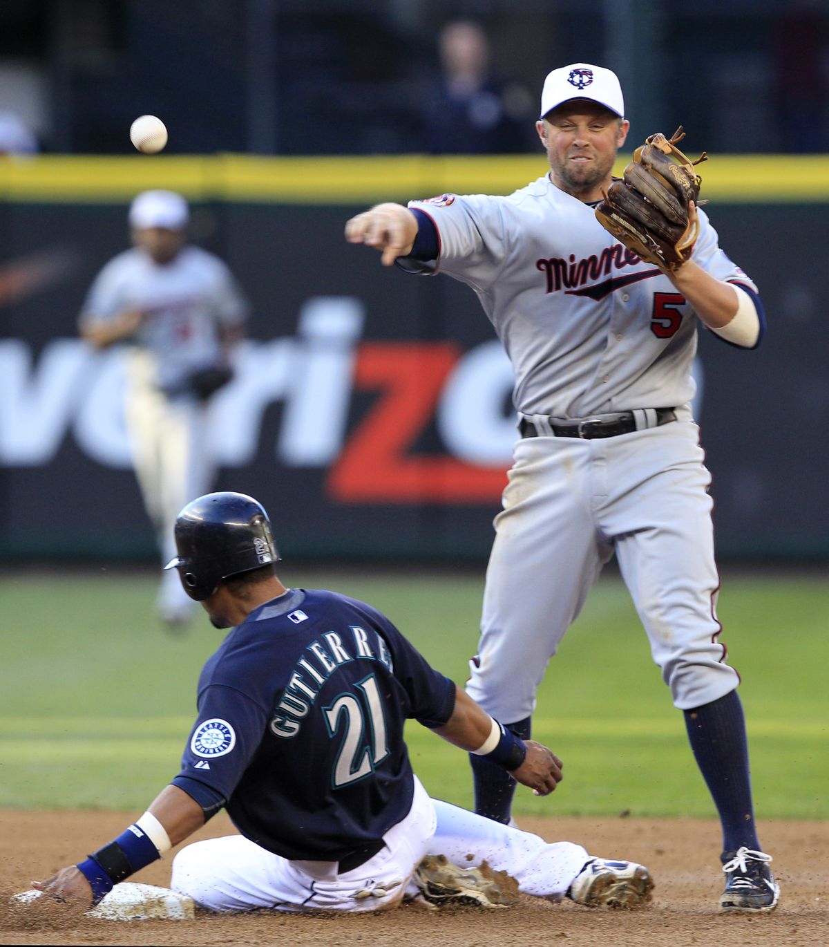 Seattle’s Franklin Gutierrez is forced at second by Minnesota’s Michael Cuddyer as the Twins turn a double play.  (Associated Press)