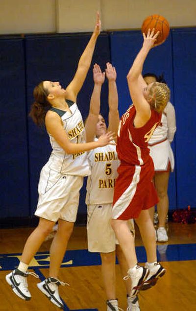 
Lexie Pettersen, left, and Shadle Park teammate Tori Dezellem defend against Ferris' Liz Boyden during last week's Greater Spokane League game. 
 (Jesse Tinsley / The Spokesman-Review)