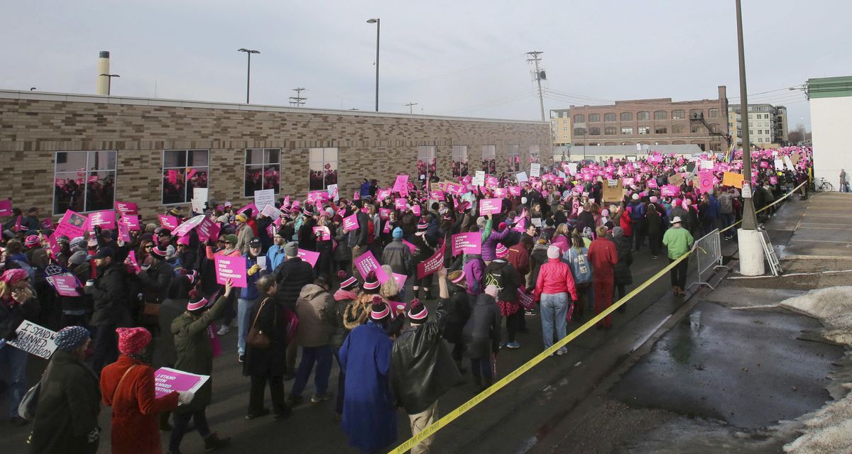 Defend Planned Parenthood supporters march outside the Planned Parenthood center in St. Paul, Minn., on Saturday, Feb. 11, 2017. (David Joles / AP)