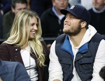 In this Nov. 17, 2015 photo, Detroit Lions quarterback Matthew Stafford and his wife Kelly smile while watching the Detroit Pistons play the Cleveland Cavaliers during an NBA basketball game, in Auburn Hills, Mich. (Duane Burleson / Associated Press)