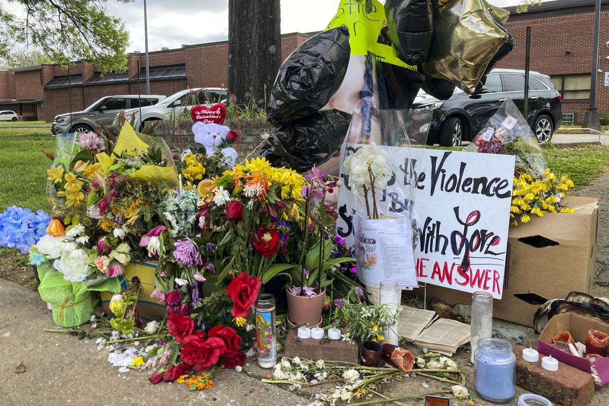In this April 21, 2021 photo, a memorial is seen after a shooting at Austin-East Magnet High School, in Knoxville, Tenn. Members of the Black community in Knoxville are calling for reforms to dispel longstanding disparities between Blacks and whites. They say that is one of the steps that needs to be taken to reduce increasing violence that has claimed the lives of five high school-age students this year. (Kimberlee Kruesi)