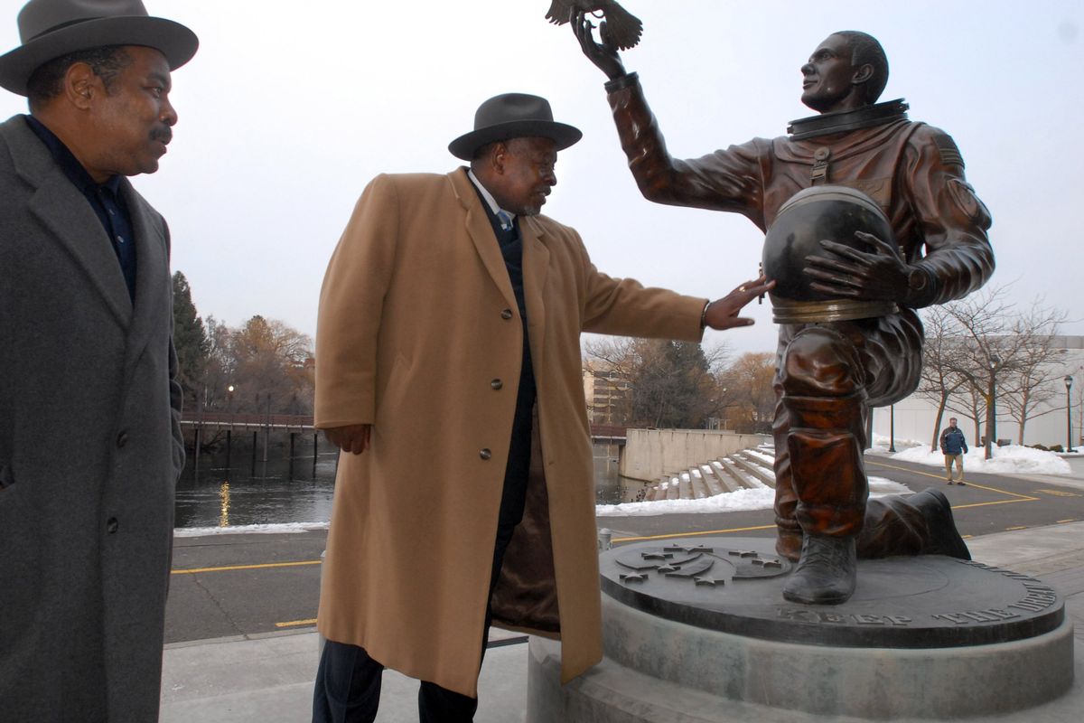 Ivan Bush and Rev. Happy Watkins admire the Michael Anderson statue by the INB Performing Arts Center on Jan. 18, 2008.  (Jesse Tinsley/The Spokesman-Review)