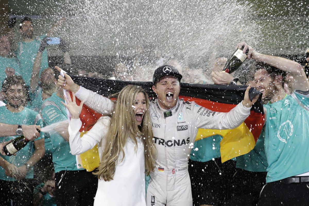 Mercedes driver Nico Rosberg of Germany celebrates winning the World Championship during the Emirates Formula One Grand Prix at the Yas Marina racetrack in Abu Dhabi, United Arab Emirates, Sunday, Nov. 27, 2016. (Hassan Ammar / Associated Press)