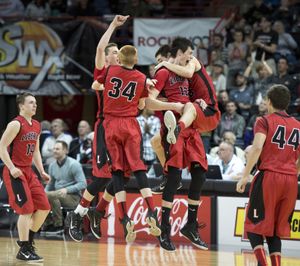 Liberty players celebrate at the buzzer after defeating Brewster 55-52 to reach the State 2B title game. (Dan Pelle)