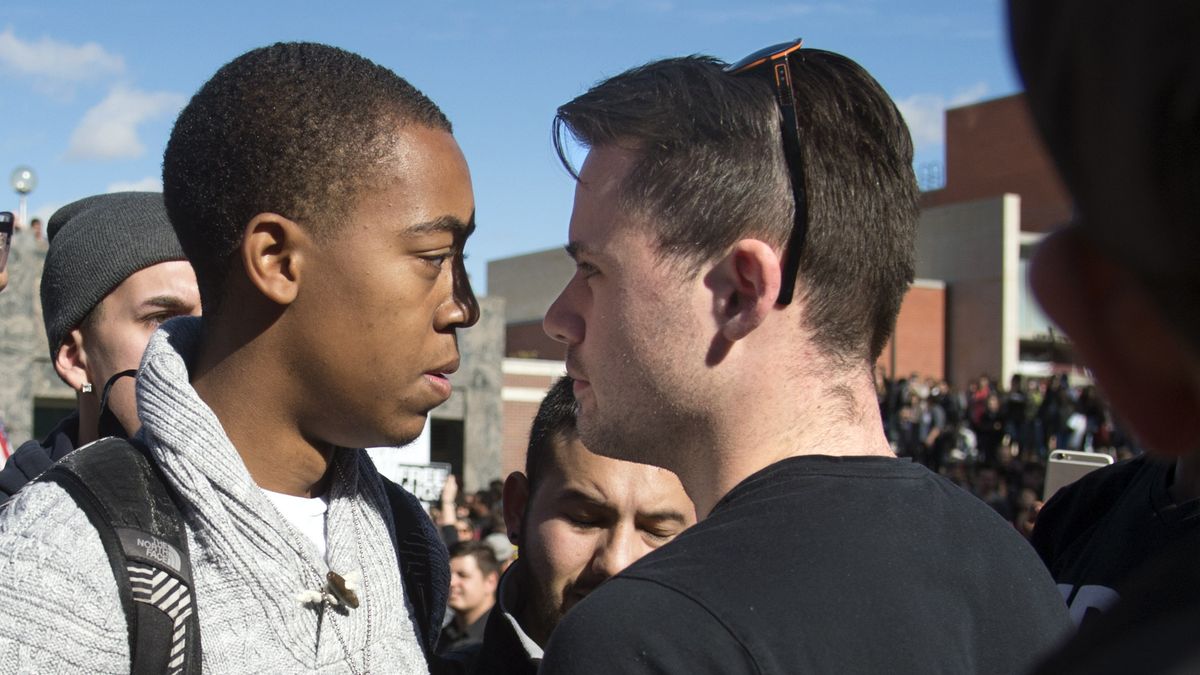 FILE - WSU student Orion Welch, left, talks to James Allsup during the WSU College Republicans Trump Wall demonstration and Unity Rally counter protest  on the WSU campus, Oct. 19, 2016. (Colin Mulvany / The Spokesman-Review)