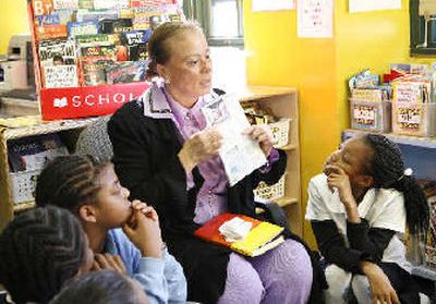 
Muhammad Ali's wife, Lonnie Ali, introduces a reading program to students at PS 149 in New York City. 