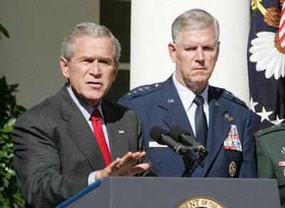 
President Bush makes a statement on Iraq Wednesday at the White House. With him is Air Force Gen. Richard B. Meyers, chairman of the Joint Chiefs of Staff. 
 (Associated Press / The Spokesman-Review)