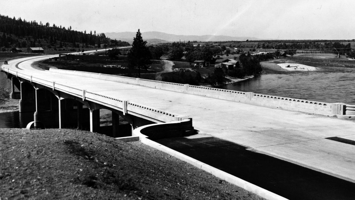1940: A new four-lane concrete bridge over the Spokane River near the Washington-Idaho line was opened in May 1940 by officials from Spokane and Idaho with dedication ceremonies. The bridge was part of a new 41/2-mile connecting highway from Spokane. In the upper right-hand section of the picture, a steel bridge dating back to 1911 can be seen. The new bridge carried traffic from Spokane to Coeur d’Alene more than 20 years before Interstate 90 would be completed.  (SPOKESMAN-REVIEW PHOTO ARCHIVES)