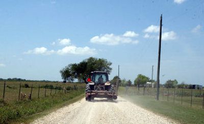 
A farmer drives down a dusty dirt road this week  north of Kaplan, La. La Nina  has pushed the jet stream and the typical west-to-east storm pattern north of southern Louisiana. 
 (Associated Press / The Spokesman-Review)