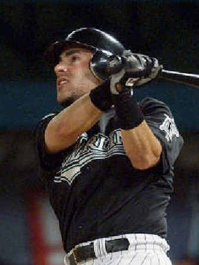 
 Paul Lo Duca homers in his first at-bat for the Marlins on Saturday. He was traded to Florida by Los Angeles on Friday. 
 (Associated Press / The Spokesman-Review)