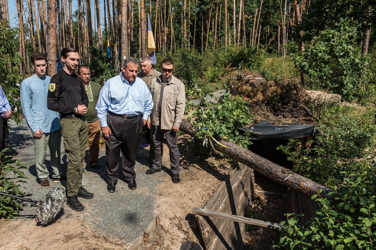 Republican presidential candidate Chris Christie looks at a trench in Moshchun, Ukraine, on Friday that was used during Russia’s offensive in March 2022. (Oksana Parafeniuk/For The Washington Post)