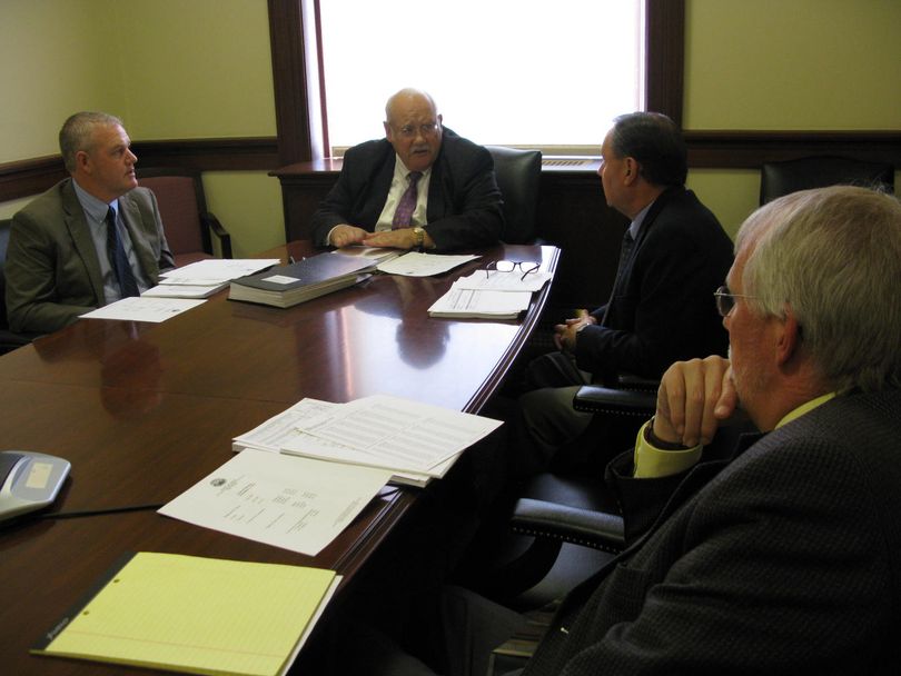 Idaho's state Board of Canvassers certifies the official results Wednesday from the Nov. 4 election. At center is Idaho Secretary of State Ben Ysursa; at left is state Controller Brandon Woolf. (Betsy Russell)