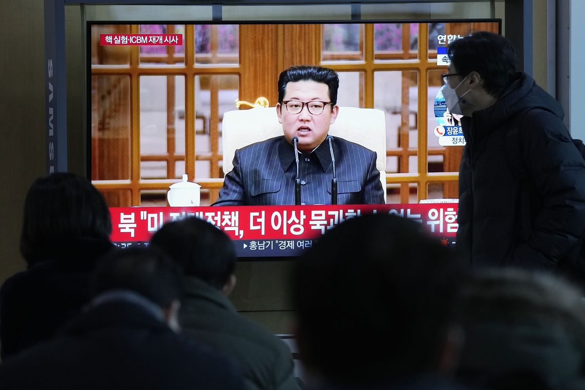 People watch a TV showing a file image of North Korean leader Kim Jong Un shown during a news program at the Seoul Railway Station in Seoul, South Korea, Thursday, Jan. 20, 2022. Accusing the United States of hostility and threats, North Korea on Thursday said it will consider restarting "all temporally-suspended activities" it had paused during its diplomacy with the Trump administration, in an apparent threat to resume testing of nuclear explosives and long-range missiles.  (Ahn Young-joon)