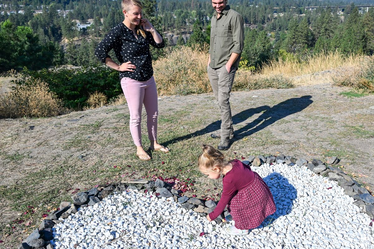 Dee and Trevor Finchamp, watching one of their daughters playing Thursday on the South Hill bluff in Spokane, operate an advertising agency, Karma Cultivate, which falls under new requirements to pay the state sales tax, which may curtail some of the services they will offer. (Jesse Tinsley/THE SPOKESMAN-REVIEW)