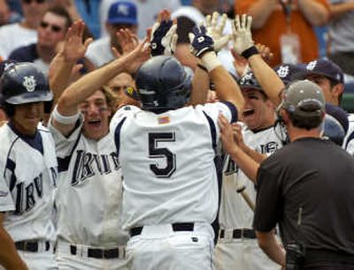 
UC Irvine's Cody Cipriano is greeted by teammates after belting a seventh-inning home run against Cal State Fullerton on Monday. Associated Press
 (Associated Press / The Spokesman-Review)