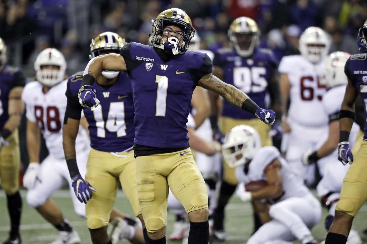 Washington’s Byron Murphy reacts after a stop against Stanford in the first half Saturday in Seattle. (Elaine Thompson / AP)